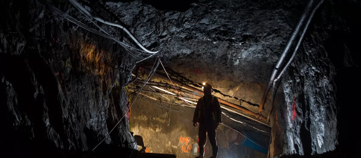 Miner standing in a mine shaft
